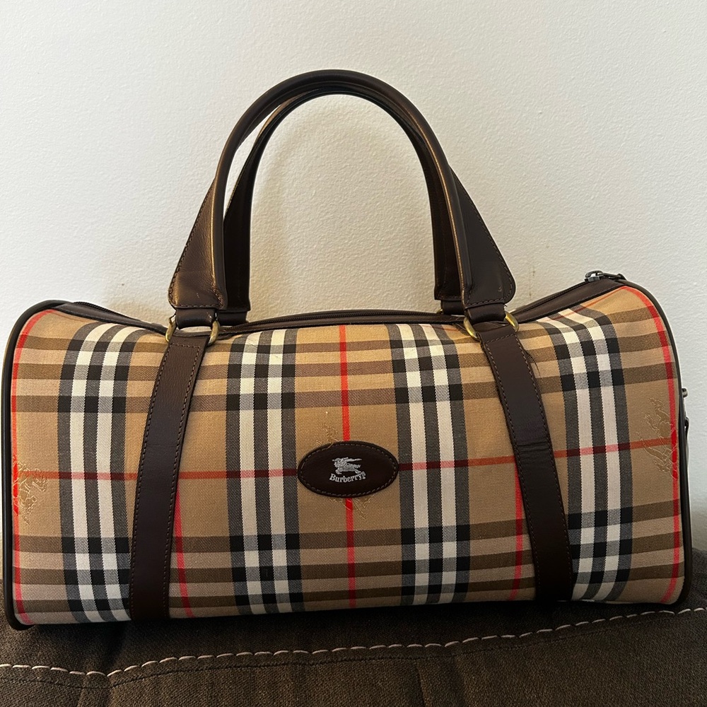 Burberrys Haymarket Boston Tan Duffel with Brown Leather Trim 10H x 19W inches
